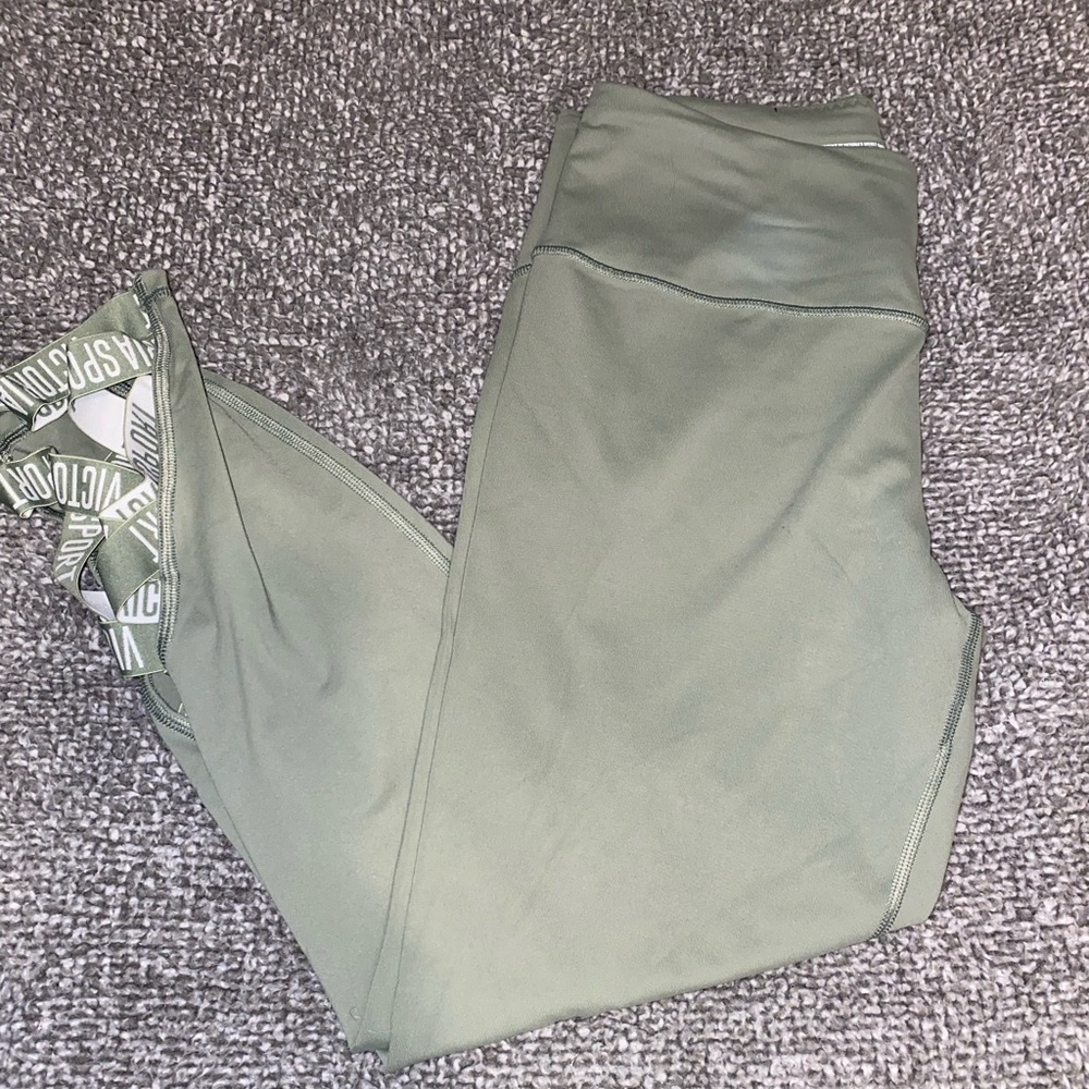 Victoria’s Secret Knockout leggings- in sage green w/ crisscross detail